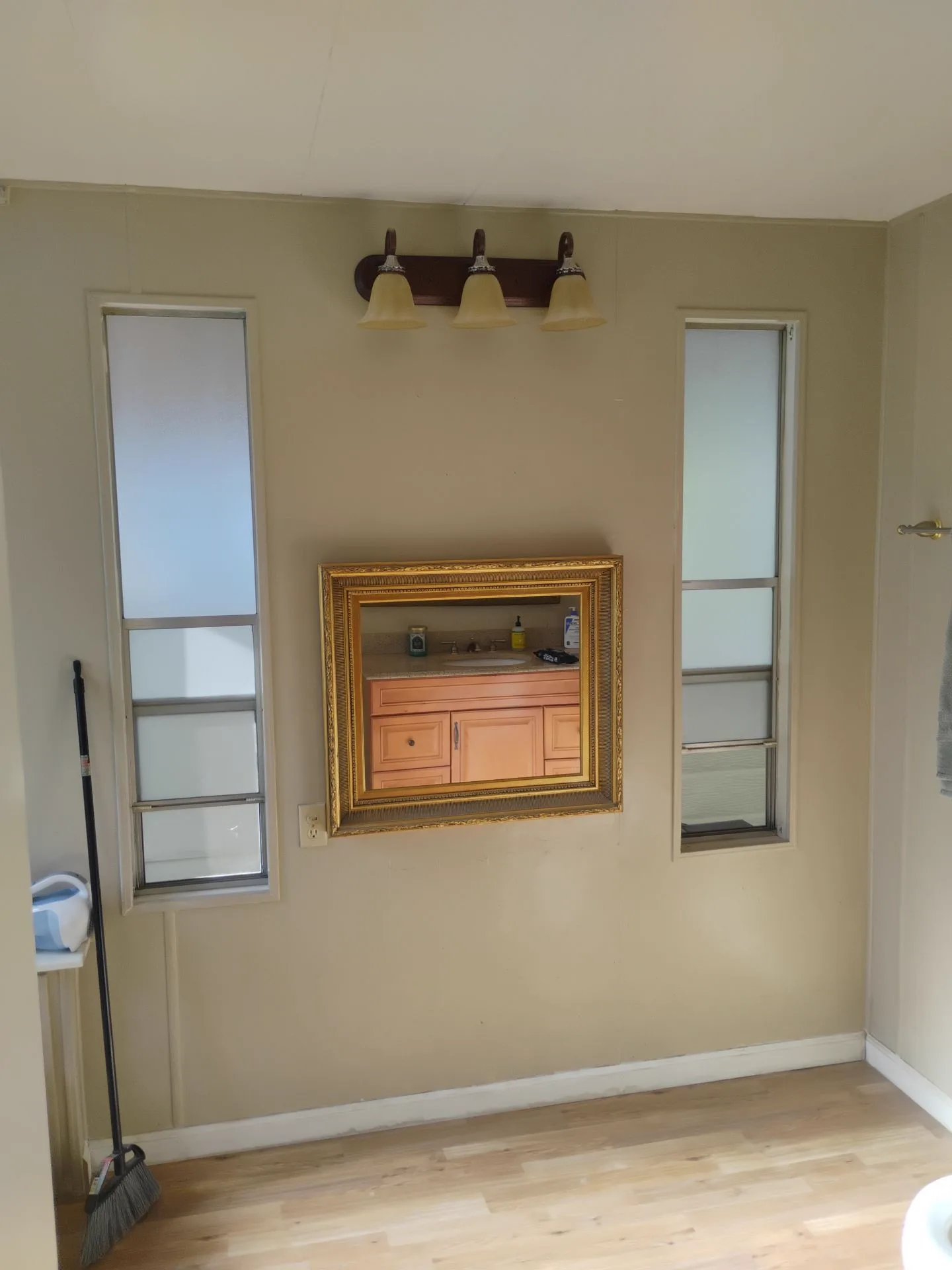 Original narrow aluminum-framed windows before replacement in San Jose, CA