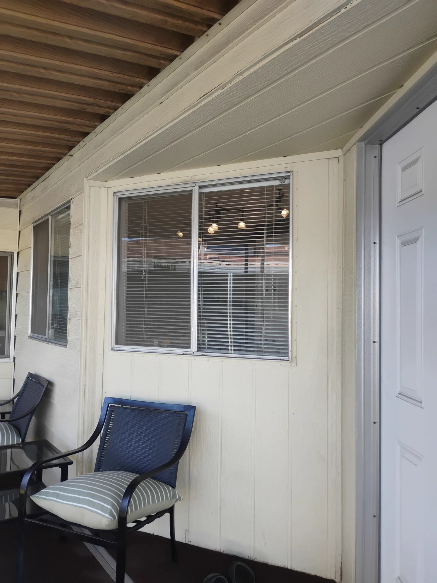Older aluminum entry windows before replacement in San Jose, CA