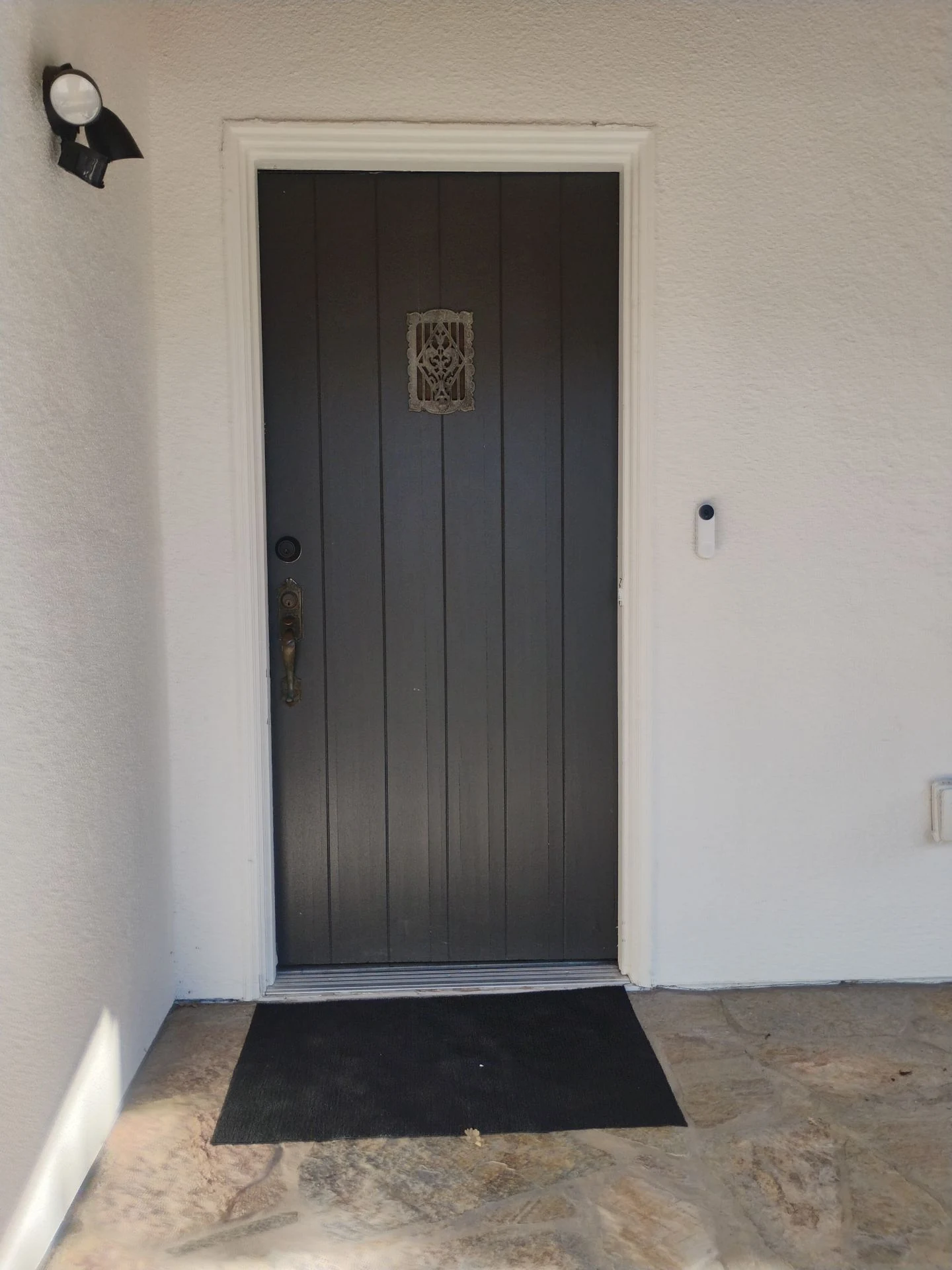 Original dark plank front door before replacement in Pleasanton, CA