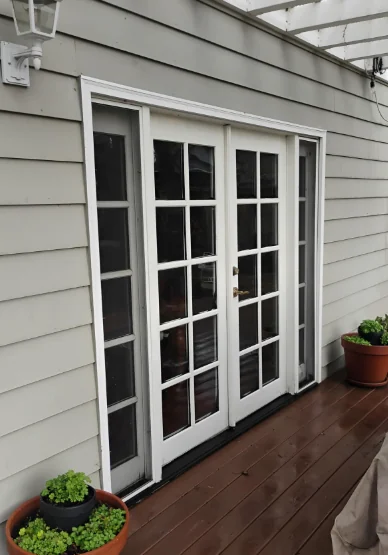 Thirty-year-old wood French doors with sidelites before replacement in Danville