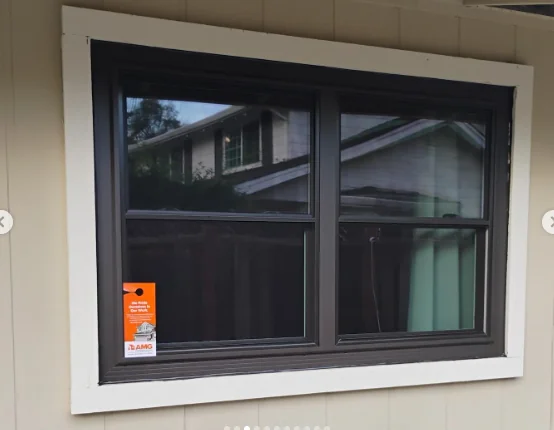 Architectural Black Anlin operating windows with white exterior trim