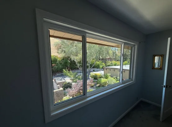 Wide Anlin sliding window with a white interior frame in a Danville home