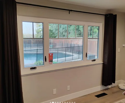 White interior Anlin window combination overlooking a backyard pool in Danville
