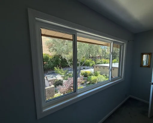 Large Anlin sliding window with a white interior frame and landscaped view in Alamo, California