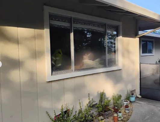 Older aluminum multi-section window before Anlin replacement in Danville