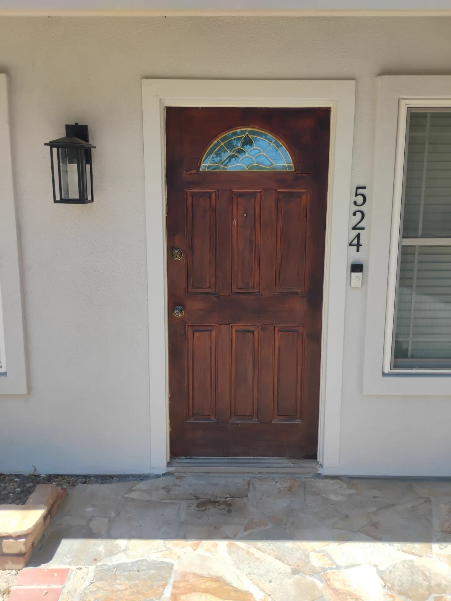 Chipped and flaking wood front door before exterior-door replacement in Livermore