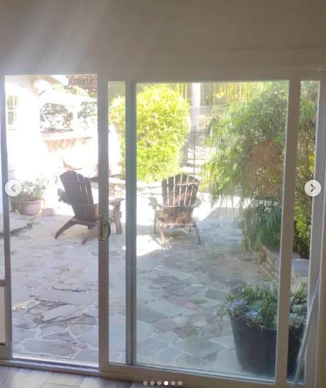 Foggy aluminum sliding patio door before replacement in Fremont, California