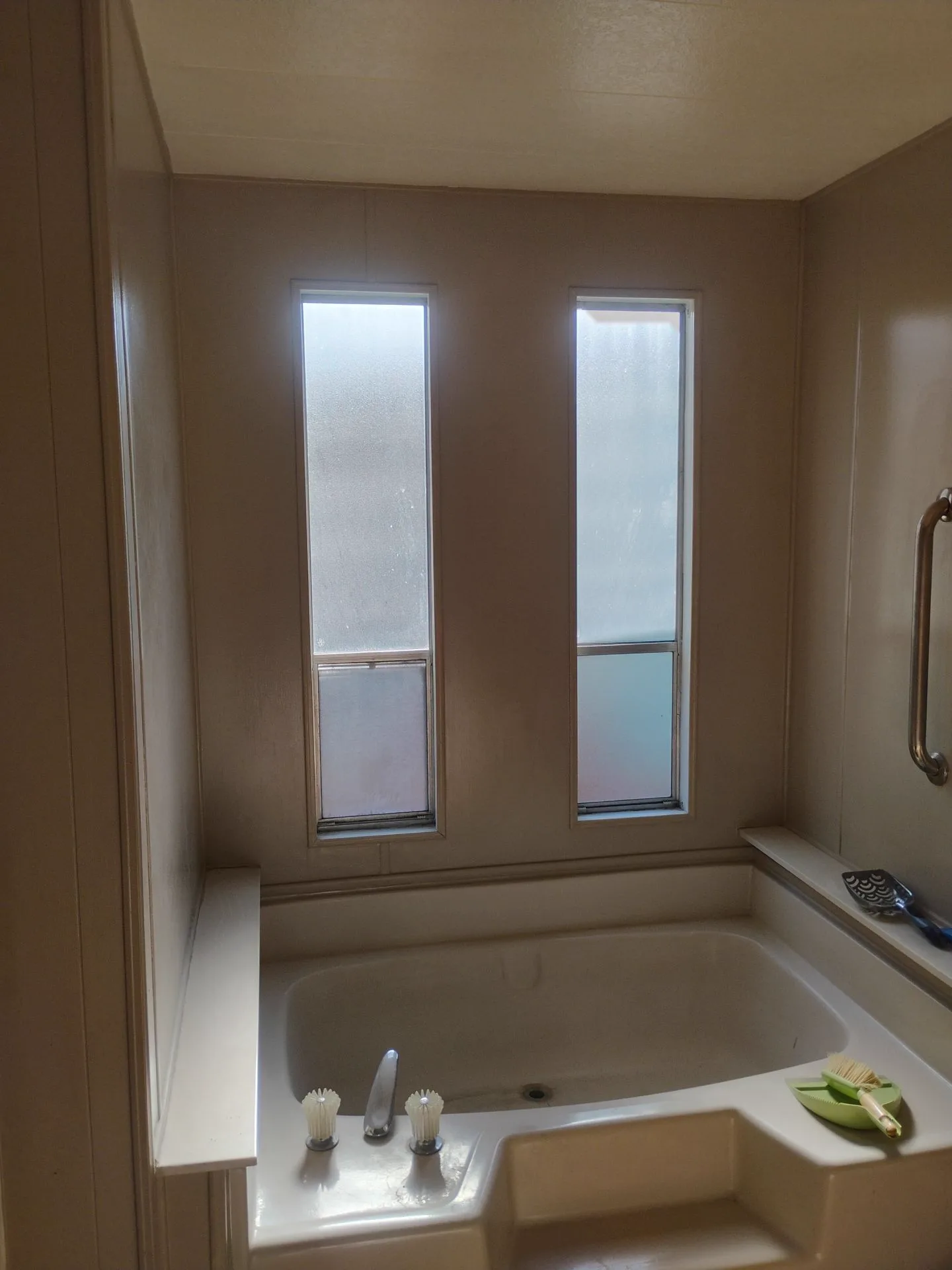 Older aluminum bathroom windows before replacement in San Jose, CA