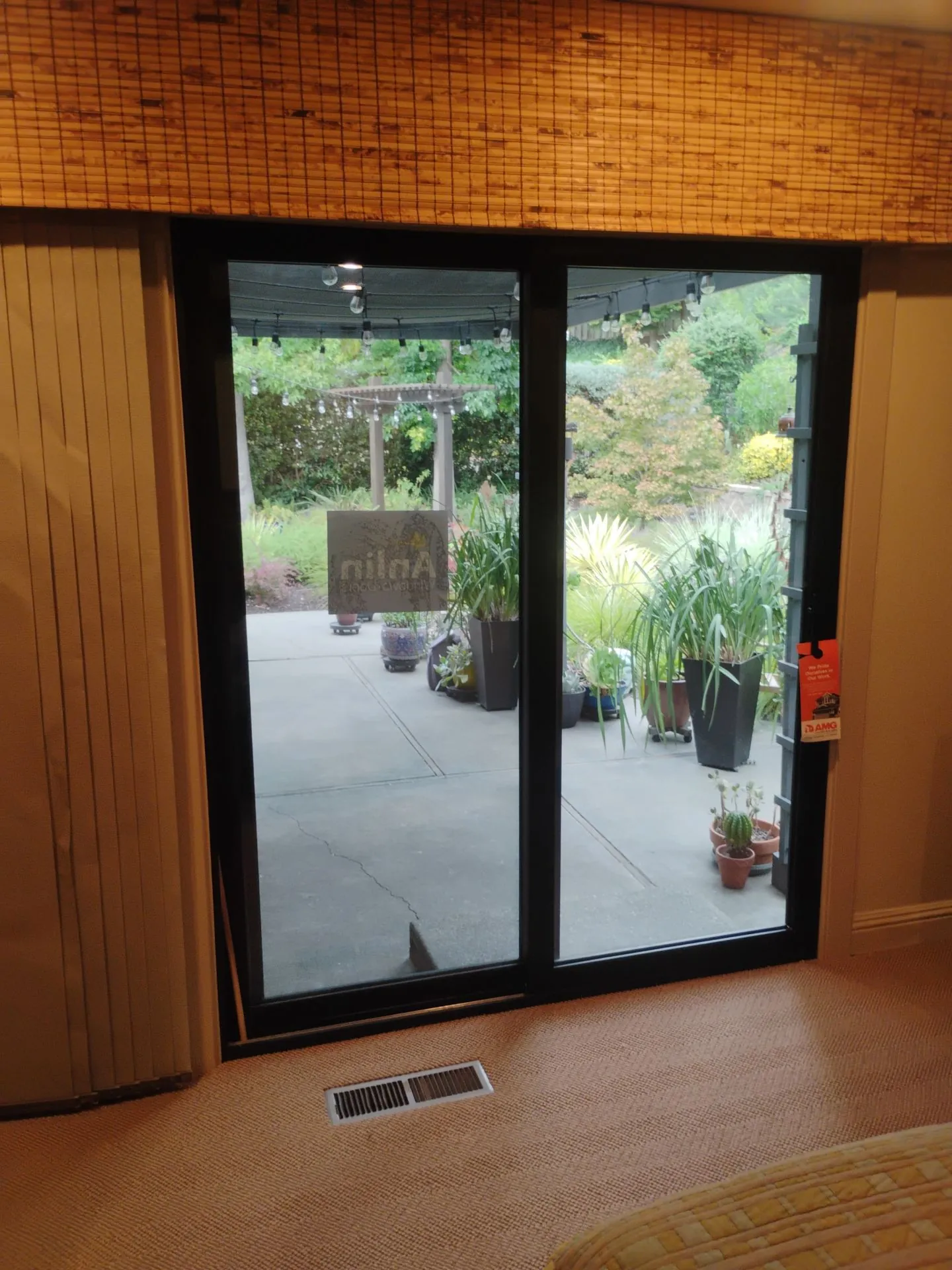 After: black-framed Anlin sliding patio door in the family room of the Danville, CA home, with the pergola and yard beyond