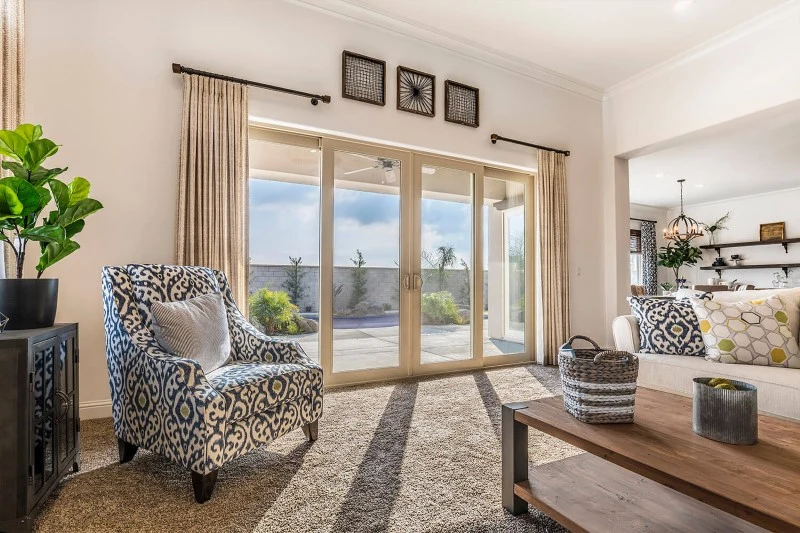 Anlin sliding patio door viewed from inside a furnished living room, opening to a patio