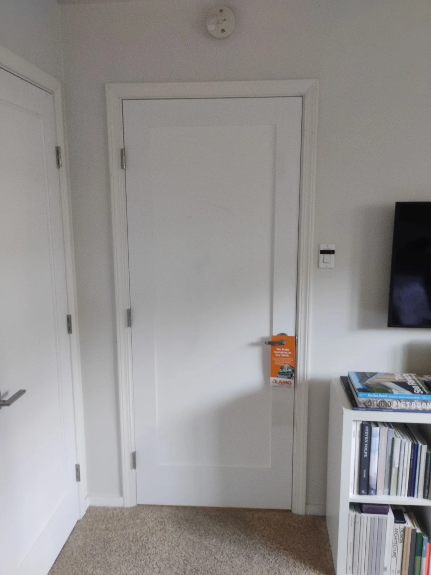 After: second bedroom door replaced with a Builders Choice Shaker-style prehung unit and new trim, San Carlos, CA