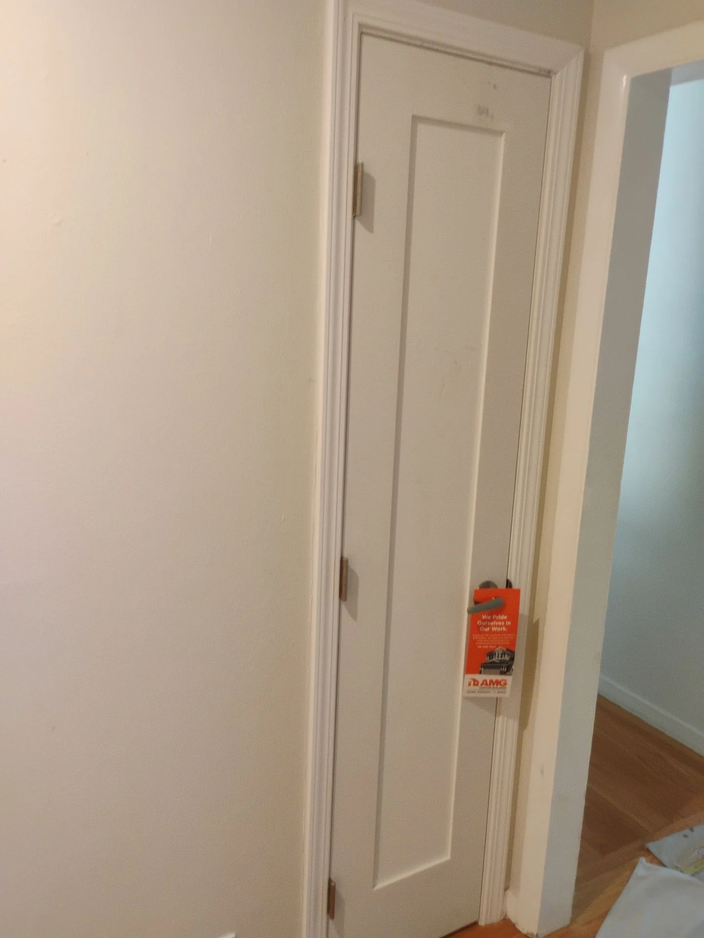 After: hallway interior door hung on satin-nickel hinges in a new full jamb, San Carlos, CA