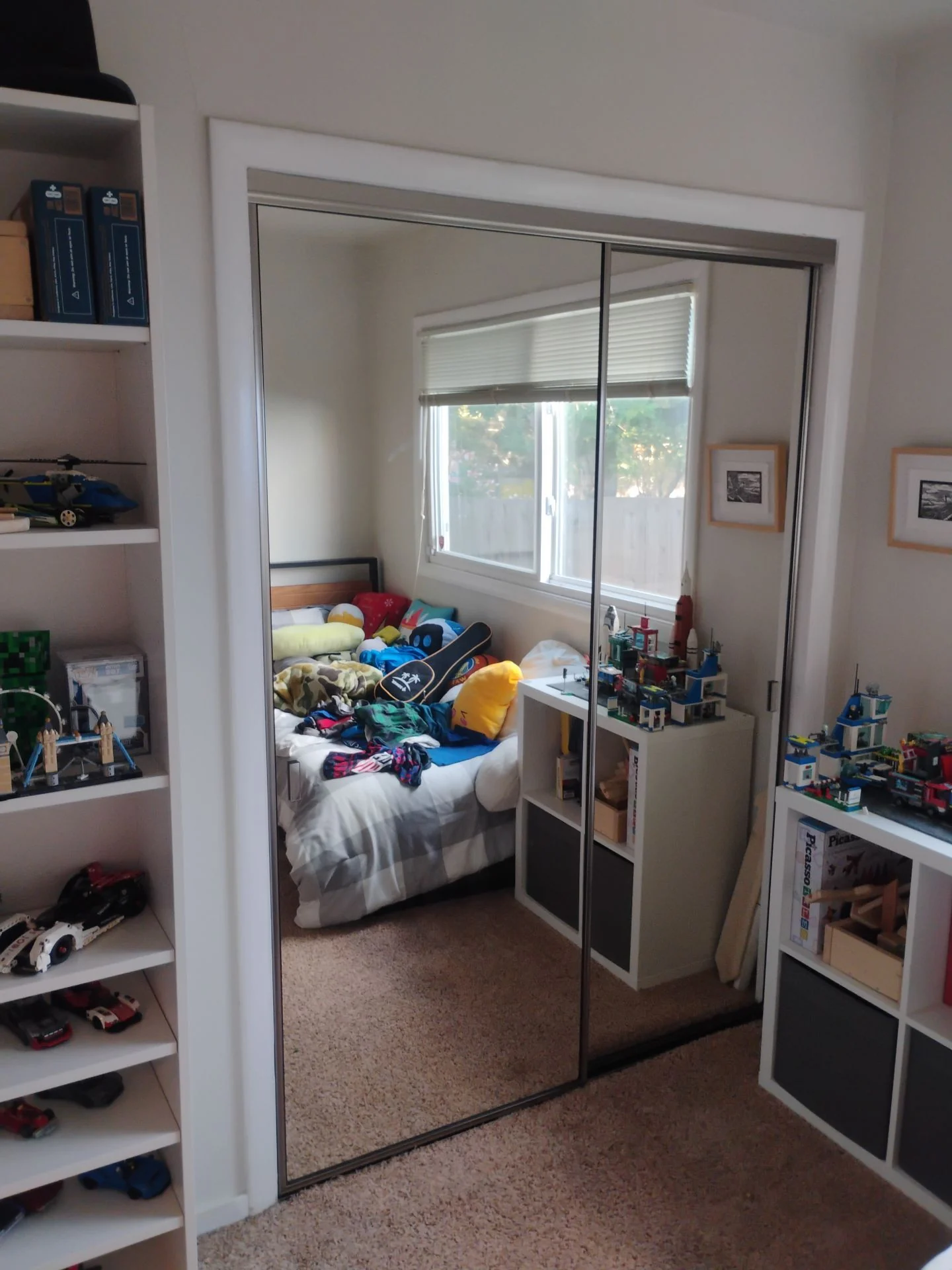After: replacement mirrored bypass closet doors set in a freshly cased opening in a San Carlos, CA bedroom