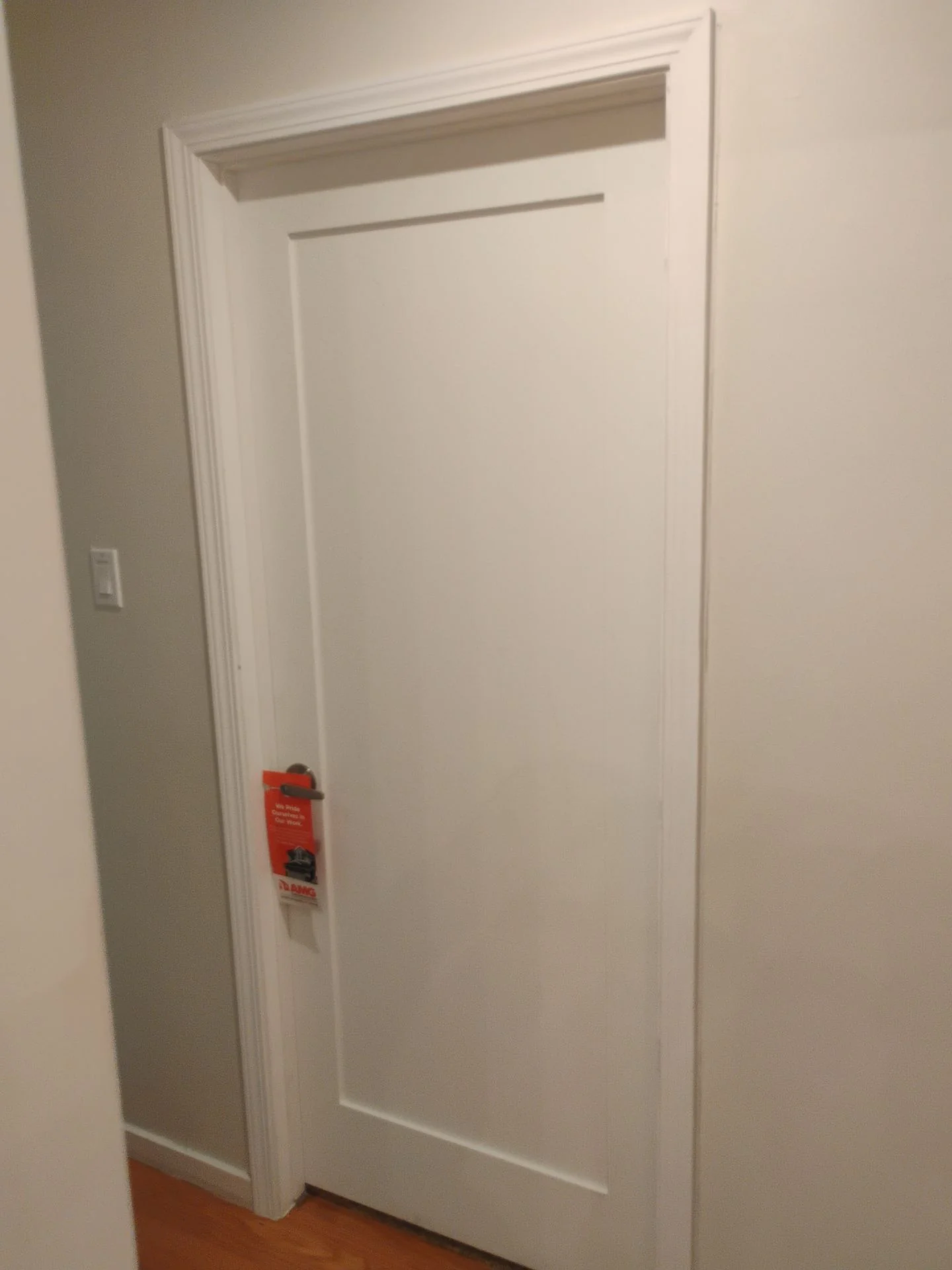 After: close view of the new painted interior door casing and square jamb detail on a Builders Choice prehung door in San Carlos, CA