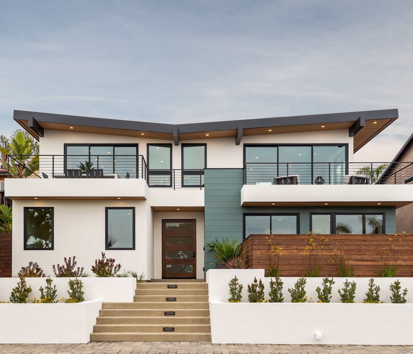 Contemporary home with Hardie® Plank + Architectural Panel in Gray