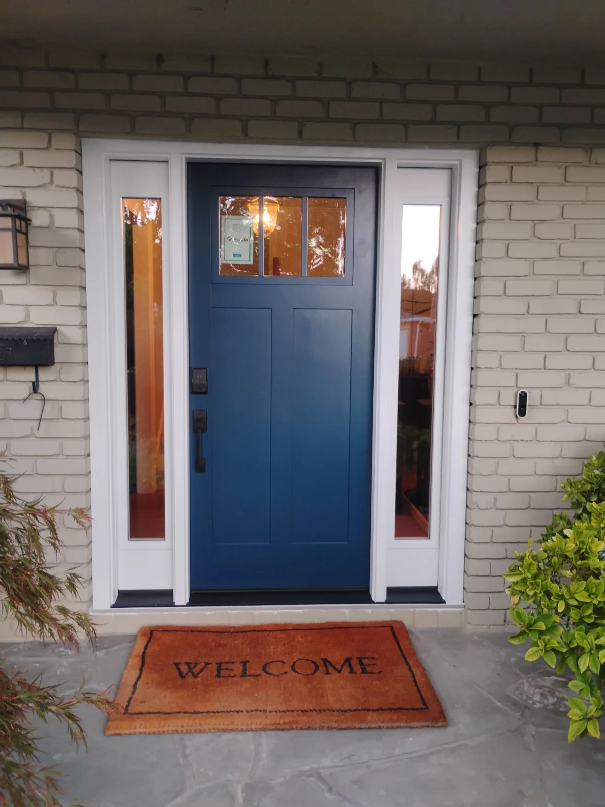 Blue ProVia Signet fiberglass front door with two sidelights installed by AMG in Danville, California