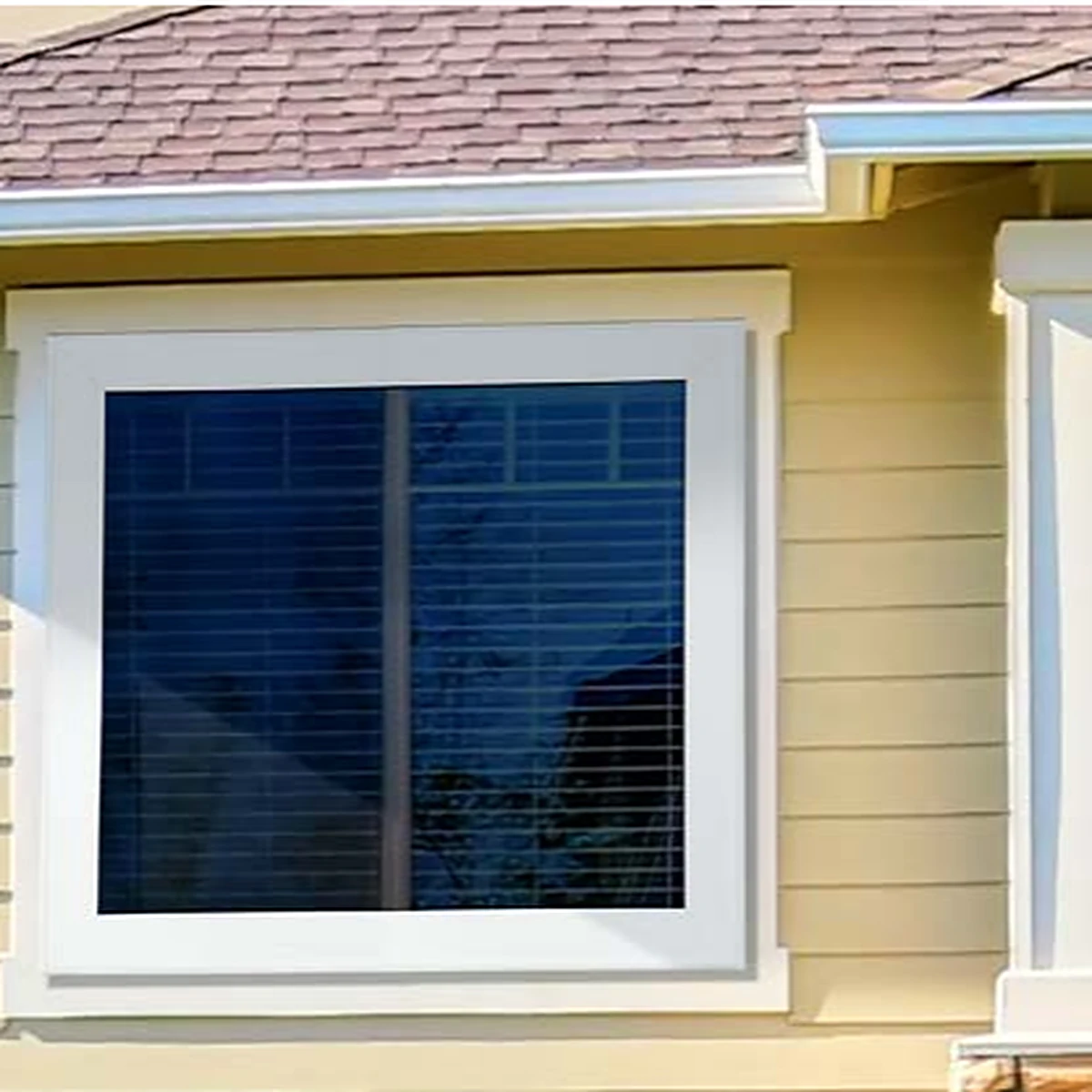 Titan Security Ultimate MeshTec security window screen installed on a ground-floor window