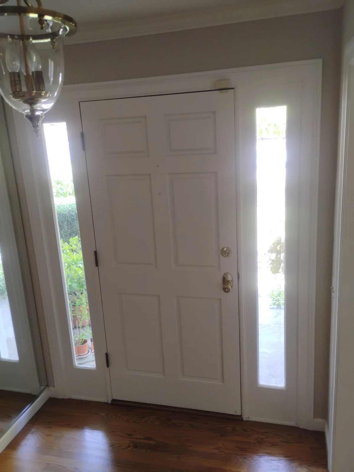 Interior of original wood entry door before replacement