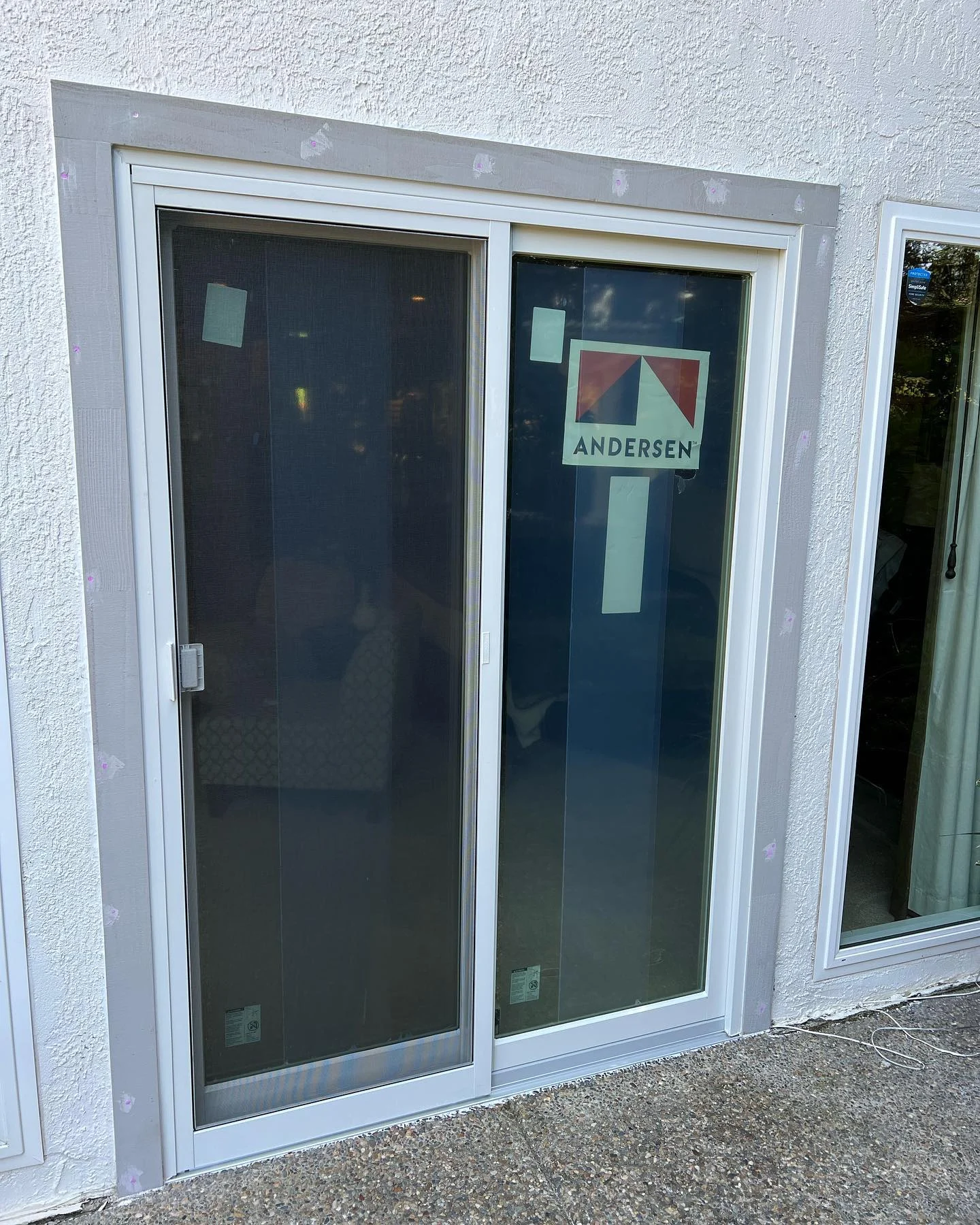Andersen 100 Series patio door installed beside glass opening in San Ramon