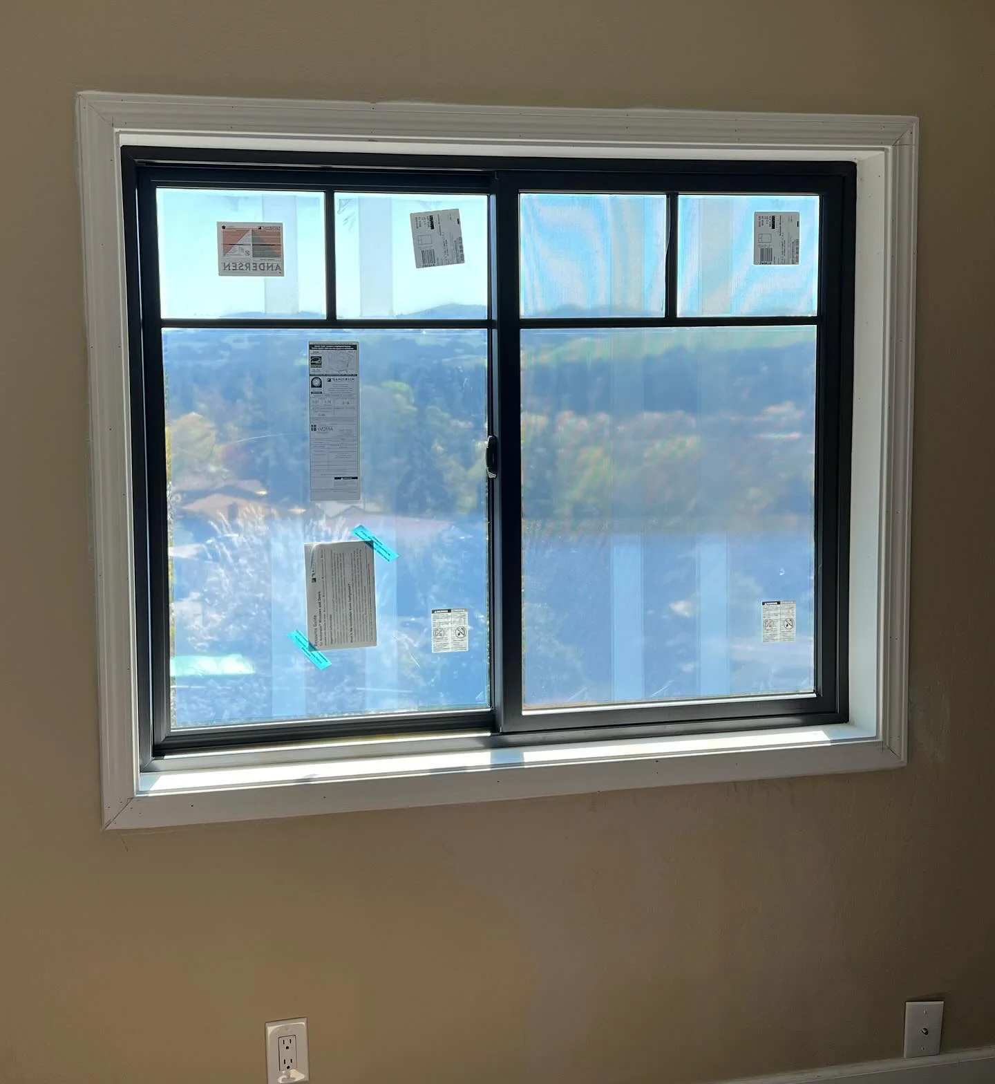Andersen 100 Series black gliding replacement window installed in a Danville CA home