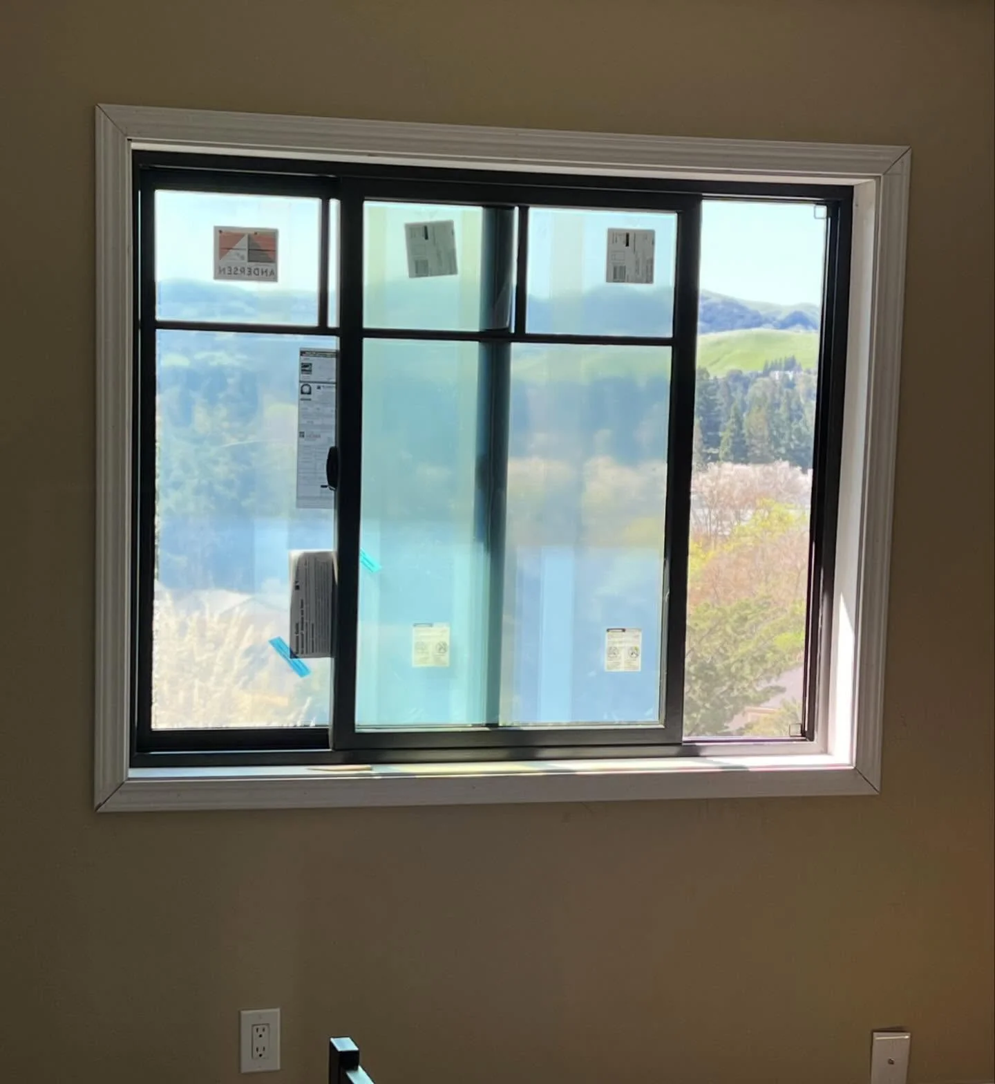 Interior view of black Andersen 100 Series sliding window replacement in Danville CA
