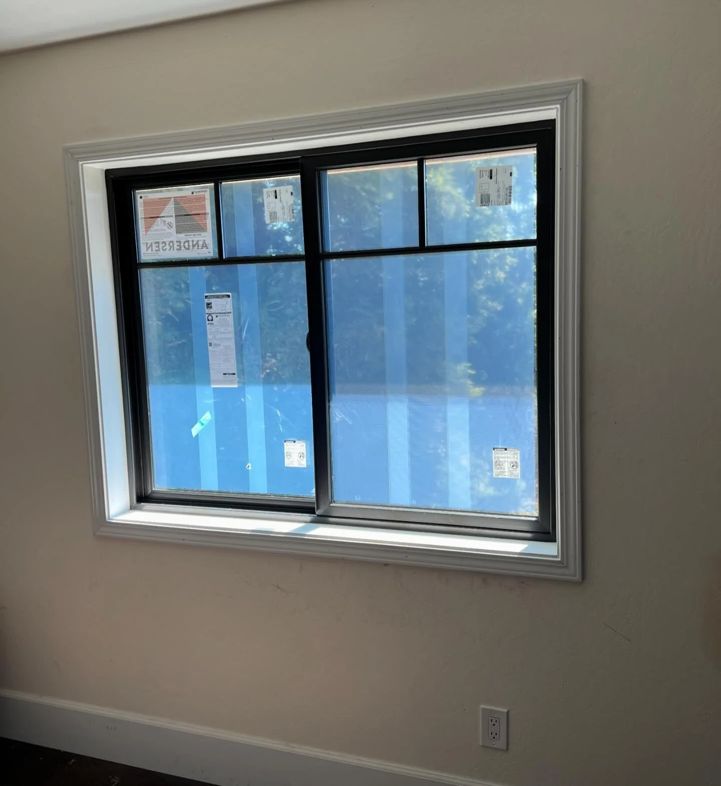 Black Andersen Fibrex composite window with white casing installed in Danville California