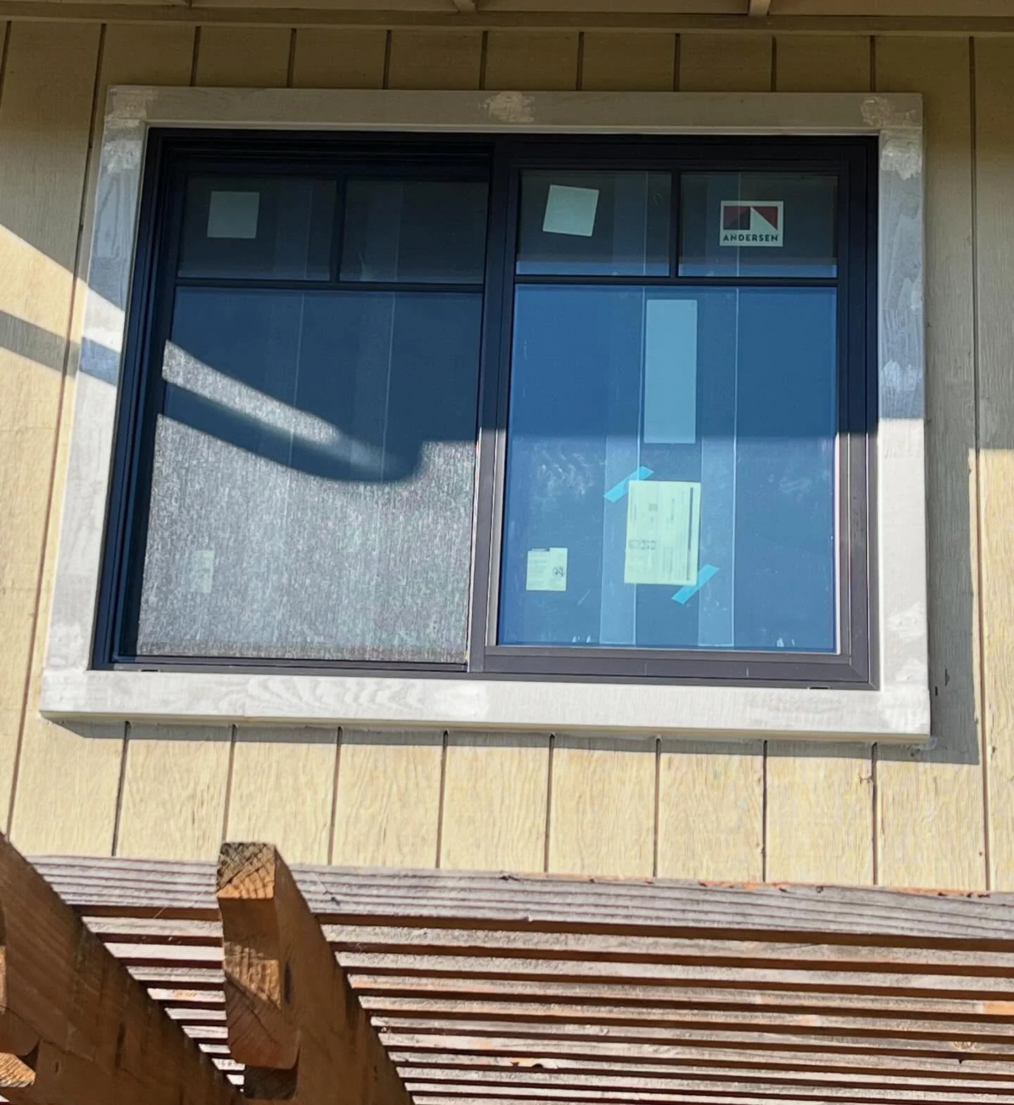 Black Andersen 100 Series gliding window replacement above a deck in Danville CA