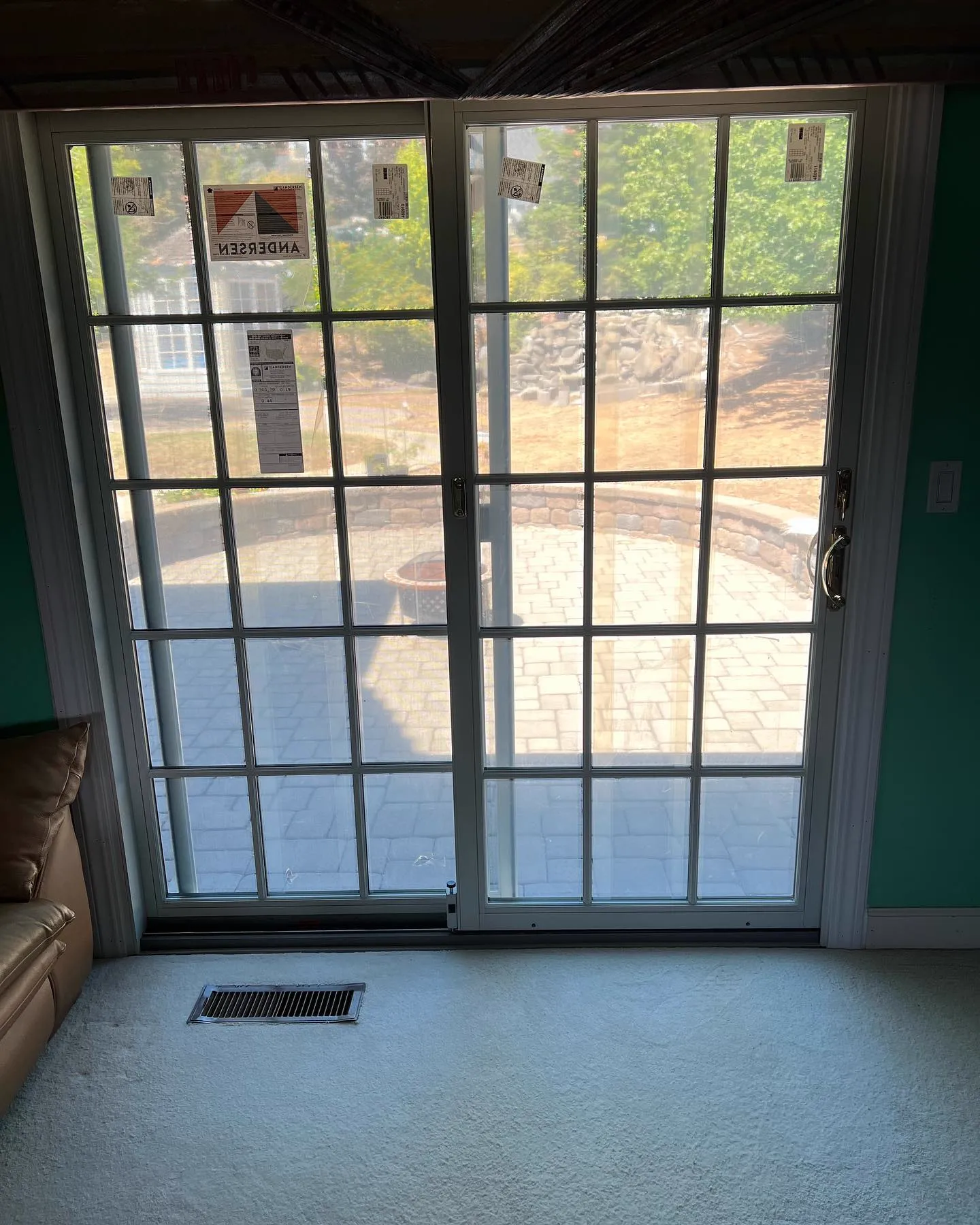 Interior of white Andersen Frenchwood sliding patio door with Colonial grilles in Pleasanton