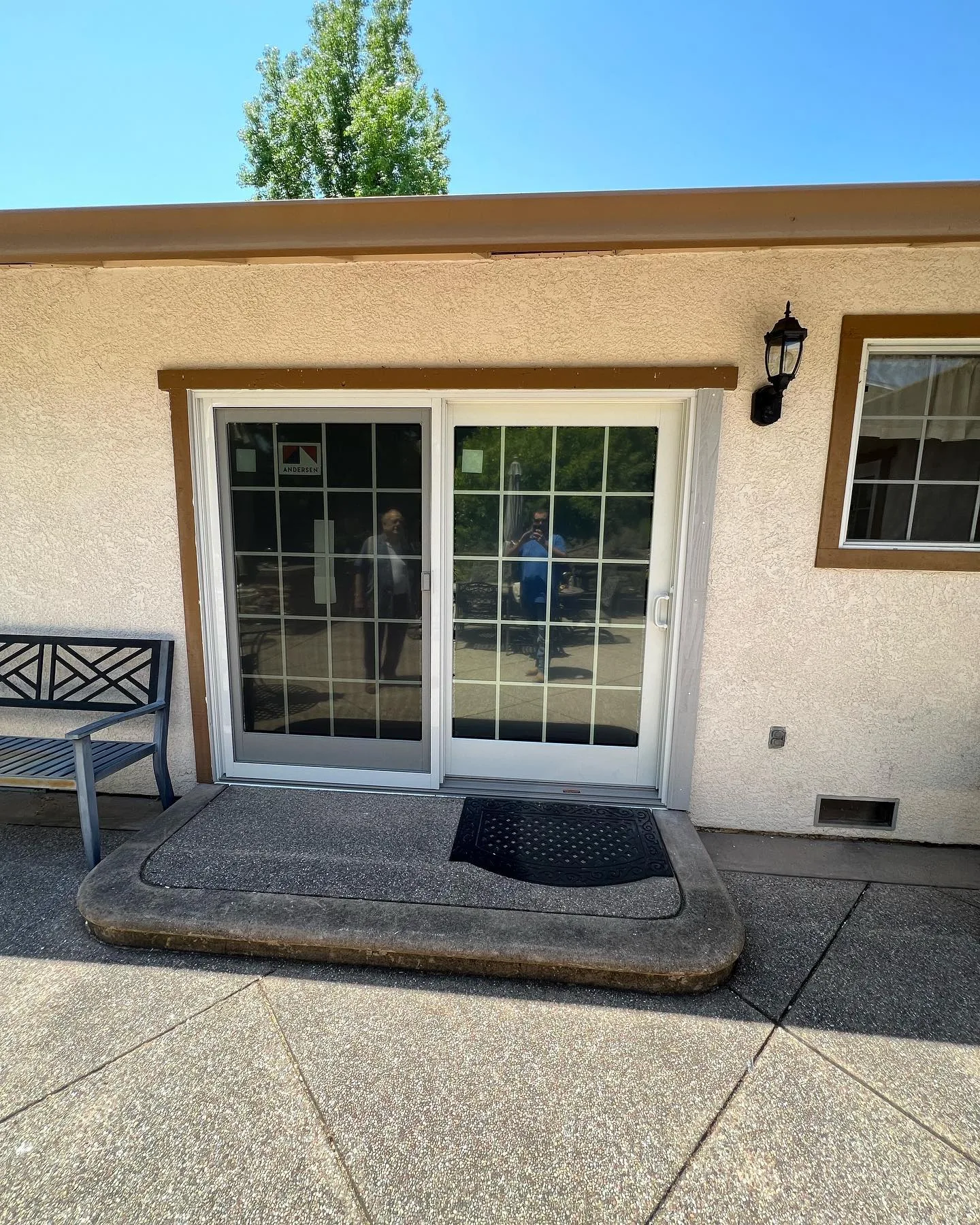 Finished Andersen 400 Series patio door viewed from the backyard of a Danville home