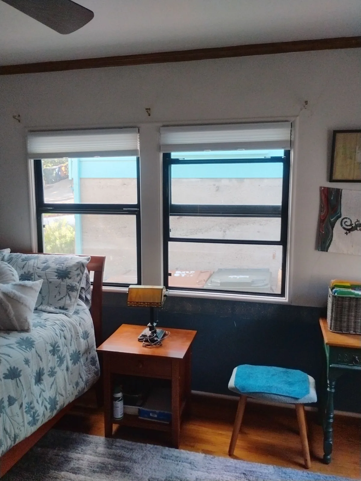 New white-framed windows in a Martinez bedroom with clearer outdoor views