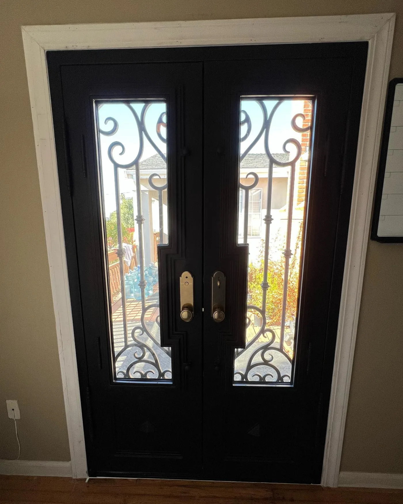 Interior view of custom double iron doors with clear glass in El Sobrante California