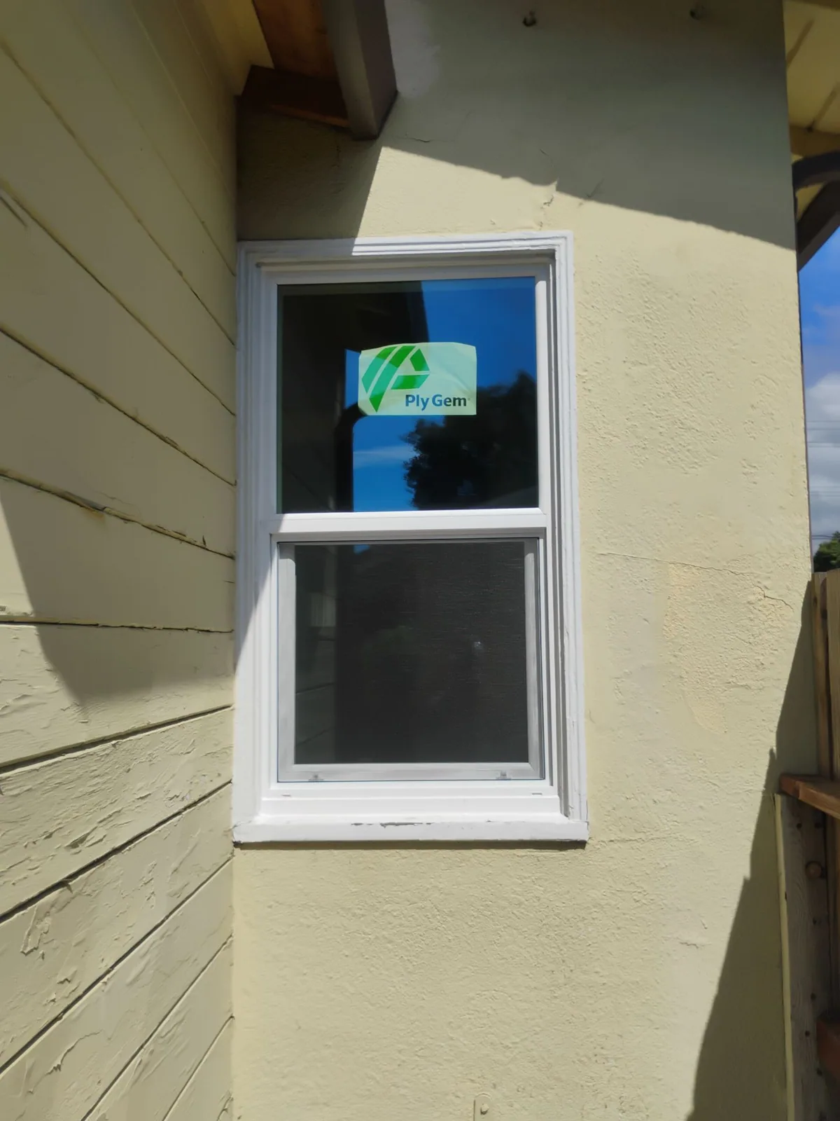 Completed white vinyl replacement window in Hayward, California