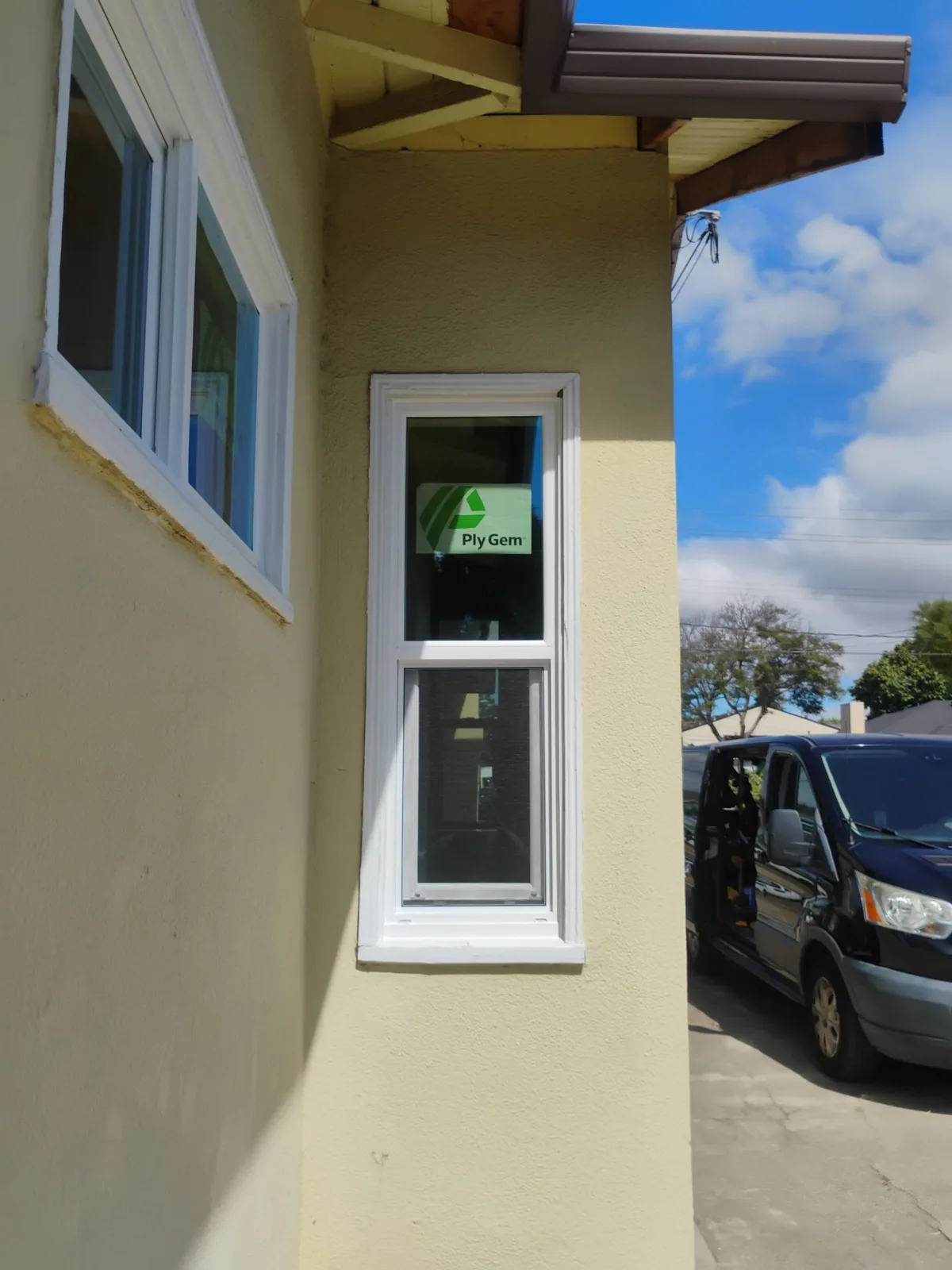 Ply Gem replacement windows along the side elevation of the Hayward house