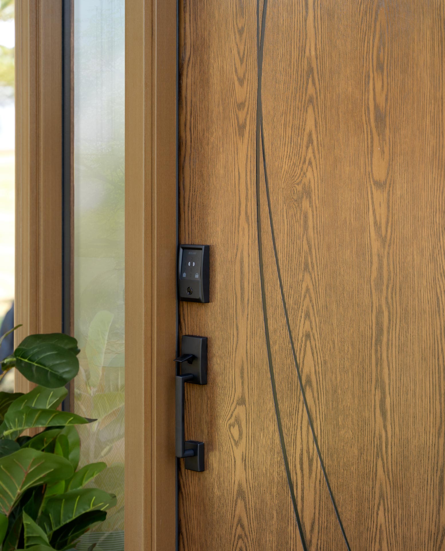 Ascent™ White Oak fiberglass entry door installed on a modern home